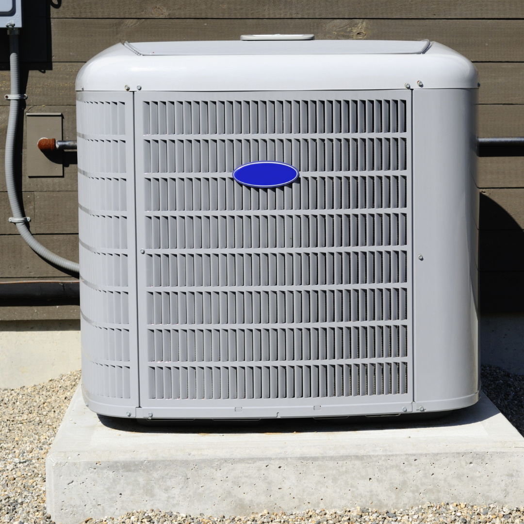 Outdoor HVAC unit installed beside a building, representing heating and cooling systems as a key part of energy management.